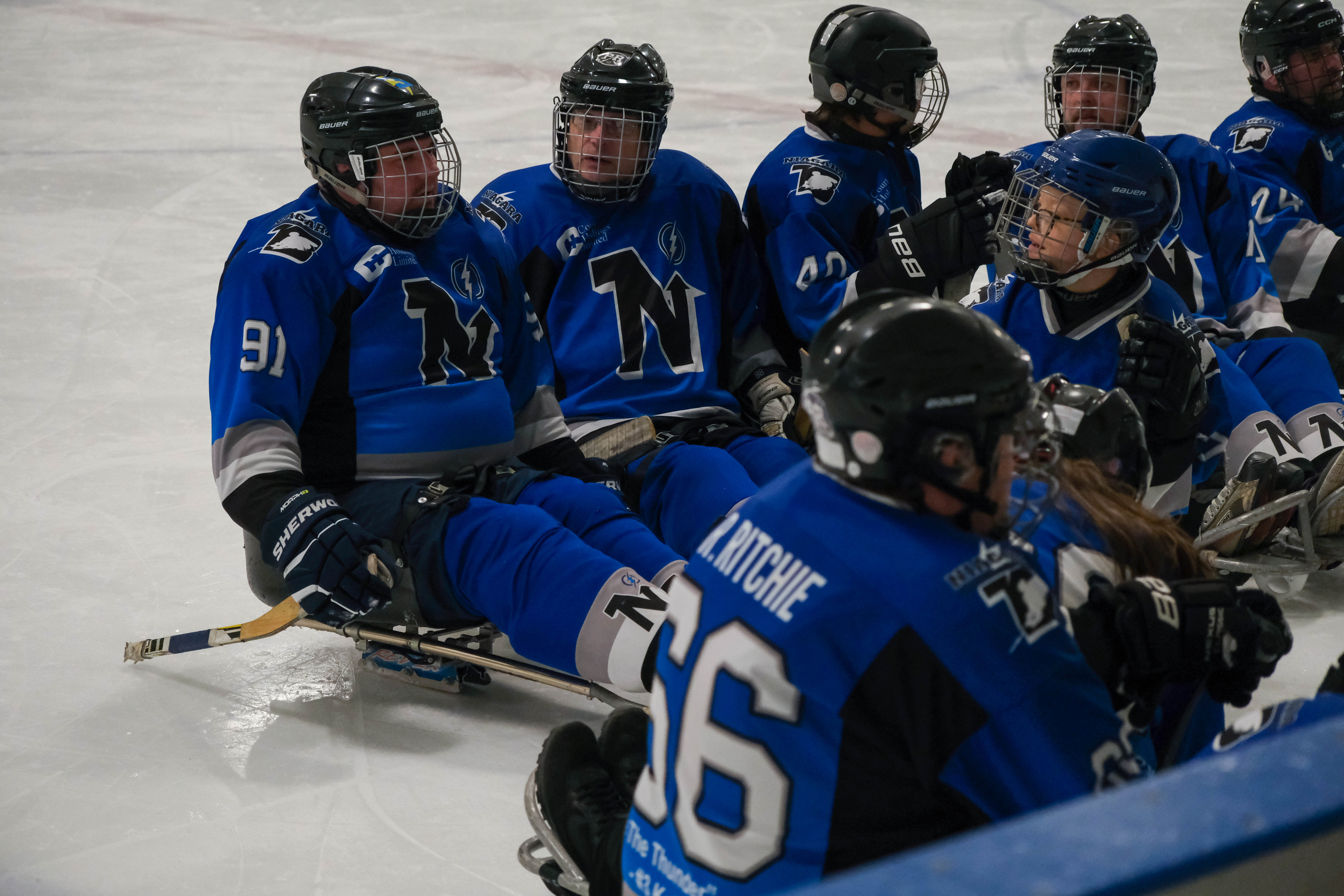 Niagara Thunderblades Para Ice Hockey players on the ice.